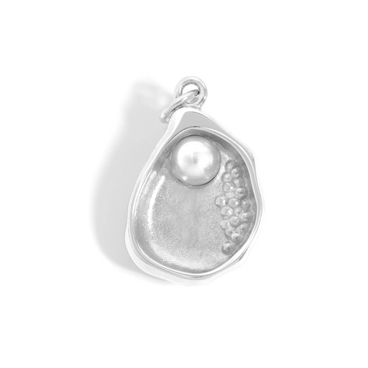 Silver pendant with a pearl on a white background